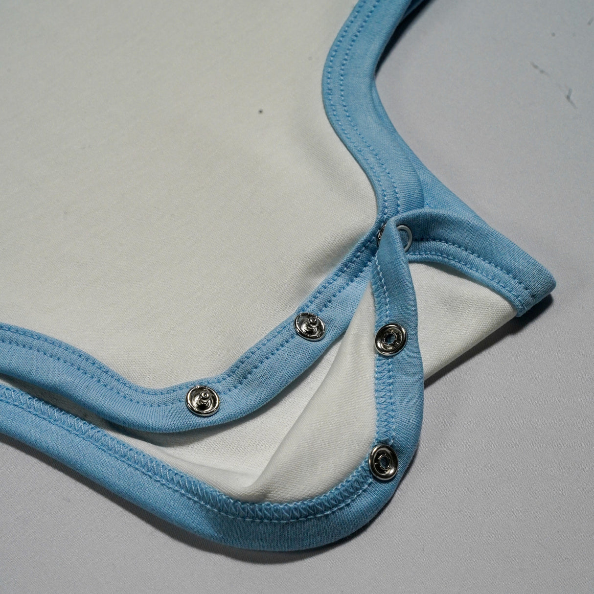 100% Peruvian Pima Cotton White with Chambray Blue Short Sleeve Snap Bodysuit - HoneyBug