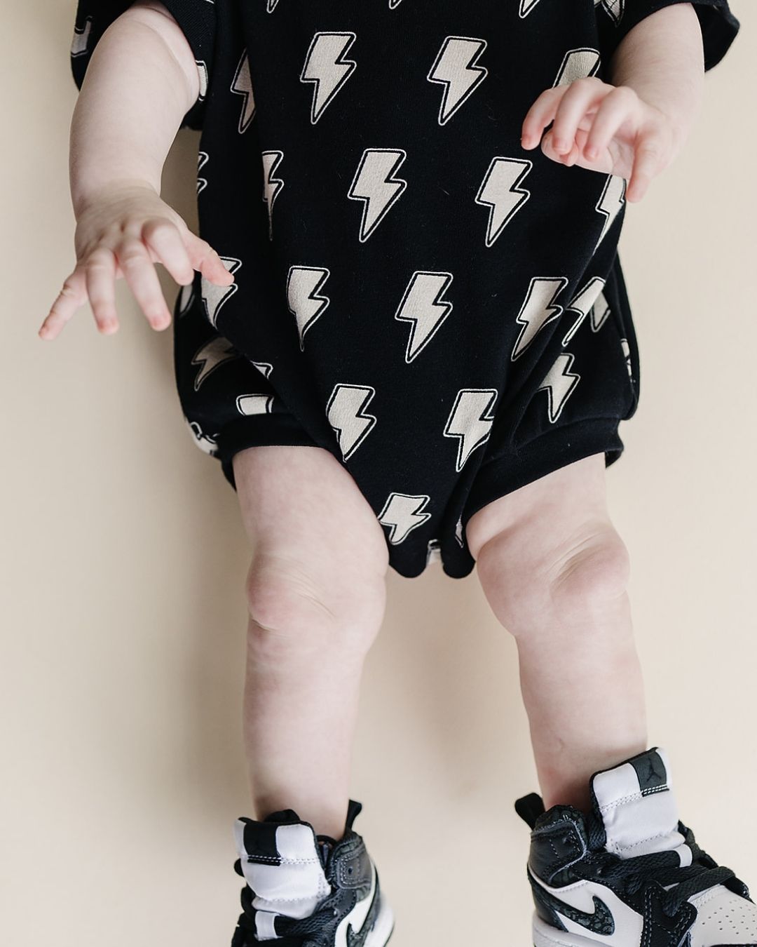 Short Sleeve Bubble Romper | Black Bolts - HoneyBug