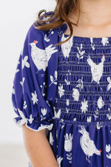 Feathered Friends Smocked Ruffle Dress