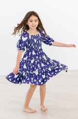 Feathered Friends Smocked Ruffle Dress